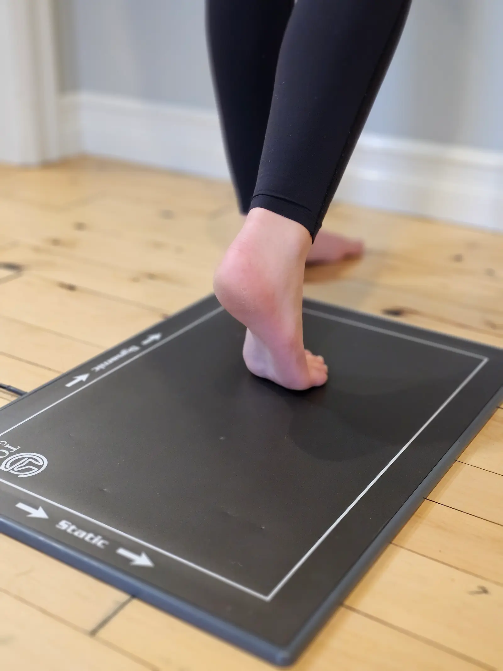 A bare foot on a foot-scanning plate
